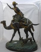 A large bronze figure on an Arab riding a camel