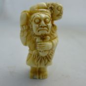 A Chinese bone figural netsuke