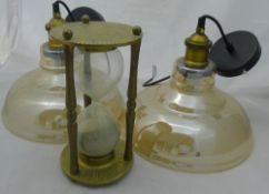 A pair of glass hanging lights,