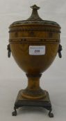 An early 20th century carved wooden lidded urn