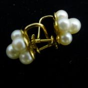 A pair of 14 k gold earrings