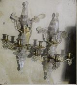 A pair of ornate cut glass mounted wall lights