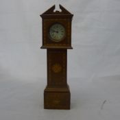 A miniature inlaid long case clock