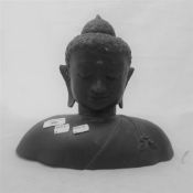 A bronze bust of Buddha