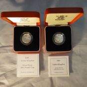 Two silver proof £1.