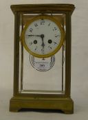 A French brass cased four glass clock