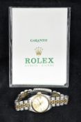 A Rolex lady's stainless steel and gold oyster perpetual watch With twenty-eight jewel movement,