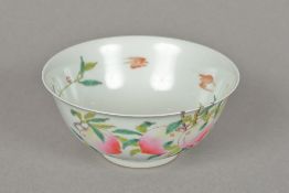 A Chinese porcelain bowl Decorated inside and out with bats amongst flowering peach trees,