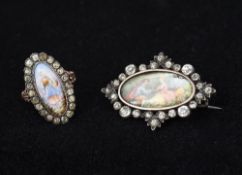 A paste mounted silver brooch Centred with a painted miniature of courting couple,