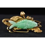 A Chinese 14K gold and jade brooch The carved jade carp amongst gold lilies and swirling water. 4.