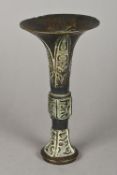 An antique Chinese bronze gu vase Of typical flared form,