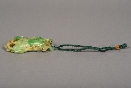 A Chinese carved green jade Buddha's finger 9.5 cm long.