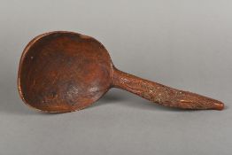 A 19th century Scandinavian carved treen ladle The hooked handle with scrolling foliate carving.