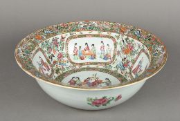 A Chinese Canton porcelain punch bowl Typically decorated with figural vignettes interspersed with