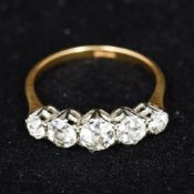 An 18 ct gold diamond set five stone ring The central stone approximately 0.5 carats.