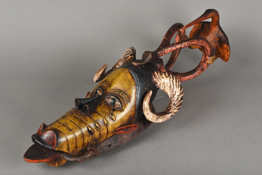 A Guro carved and polychrome decorated mask The slender zoomorphic face surmounted by horns and