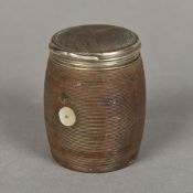 A 19th century unmarked white metal mounted treen vesta Of hinged barrel form,