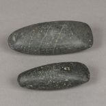 Two hardstone axe heads, possibly Neolithic period Of typical form. The largest 14 cm long.