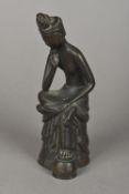 A Chinese patinated bronze model of a figure,