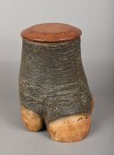 A 19th century taxidermy rhinoceros foot tobacco jar and cover 20 cm high.