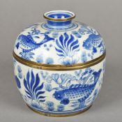 A Chinese brass mounted blue and white porcelain bowl and cover Of circular section,
