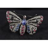 An unmarked yellow and white metal rose diamond set brooch Formed as a butterfly with pierced wings