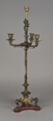 A 19th century bronze candelabra The cherub finial above three drip-pans above the central column,