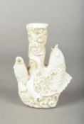 A Chinese blanc de chine porcelain vase Worked with a pair of leaping carp. 14.5 cm high.