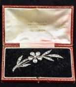 A Georgian paste set silver brooch Of floral spray form, set with an unmarked gold pin,