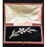 A Georgian paste set silver brooch Of floral spray form, set with an unmarked gold pin,