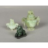 A Chinese carved jade twin handled censor and cover Together with another smaller;