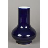 A Chinese porcelain vase Of squat bulbous form with an elongated neck decorated in an allover blue