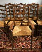 A set of eight Arts and Crafts ladder back dining chairs,