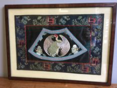 A Chinese embroidered silk rank badge Centred with a crane, framed and glazed. 48 x 35 cm overall.