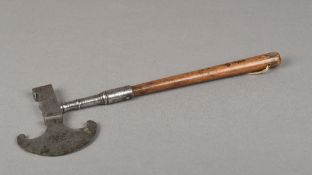 An 18th/19th century sugar axe The steel crescent blade opposing a hammer, the handle turned wood.