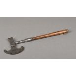 An 18th/19th century sugar axe The steel crescent blade opposing a hammer, the handle turned wood.