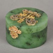 A Russian diamond and silver gilt mounted spinach jade box Of hinged cylindrical form,