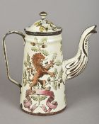 A 19th century enamelled coffee pot and cover Well decorated with rampant lions and fruiting oak