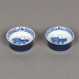 A pair of Chinese blue and white porcelain shallow cups Each decorated with a temple lion,