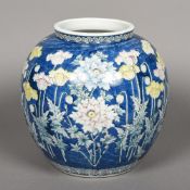 A Japanese porcelain vase Decorated with floral sprays, blue painted mark to base. 29 cm high.