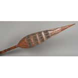 A late 19th/early 20th century African carved wooden tribal paddle,