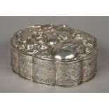 A 19th century Chinese silver box The shaped hinged lid embossed with insects amongst fruit,