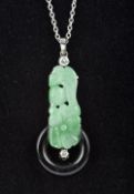 An Art Deco diamond set platinum mounted carved jade and onyx pendant Mounted on a platinum chain.