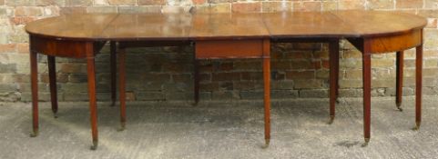 A 19th century mahogany D-end dining table The rounded rectangular top incorporating two additional