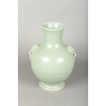 A Chinese porcelain twin handled baluster vase With allover celadon glaze. 28 cm high.