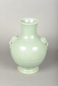 A Chinese porcelain twin handled baluster vase With allover celadon glaze. 28 cm high.