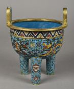 A Chinese cloisonne Ding censor Typically decorated with dragons and lotus strapwork,