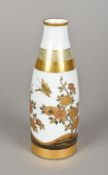 A late 19th century Japanese Kutani sake bottle The white ground with gilt bands and decorated with