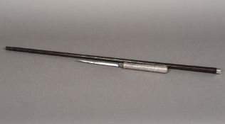 A silver mounted sword stick The woven handle with 6.5 inch blade, the shaft with silver collar.