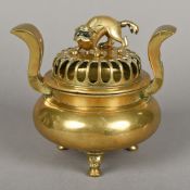 An antique Chinese polished bronze censor Of squat bulbous form with elongated pierced scrolling